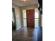 Bright entryway with wood door and tile flooring at 1501 Noble St, Longwood, FL 32750