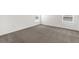 Neutral carpeted bedroom with two windows at 2676 Hancock Crossing Dr, Bartow, FL 33830