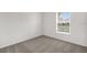 Carpeted bedroom with a window at 2676 Hancock Crossing Dr, Bartow, FL 33830