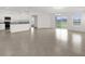 Open concept living room/kitchen with lots of natural light and tile floors at 2676 Hancock Crossing Dr, Bartow, FL 33830