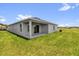 The house boasts a cozy covered patio and a sprawling green lawn, perfect for outdoor enjoyment at 2812 Gabion St, Bartow, FL 33830