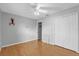 Bright bedroom with ceiling fan and laminate wood floors at 3109 Sky St, Deltona, FL 32738