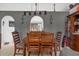 Dining room with wooden table and chairs, and decorative lighting at 3109 Sky St, Deltona, FL 32738