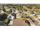 An aerial view of houses in a quiet neighborhood near a lake at 7305 Grotto Ave, Orlando, FL 32812