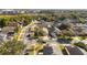 An aerial view of houses on a quiet street surrounded by trees at 7305 Grotto Ave, Orlando, FL 32812