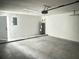 An empty garage featuring the home's hot water heater at 7305 Grotto Ave, Orlando, FL 32812