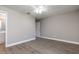 A cozy bedroom featuring wood-look flooring and a ceiling fan at 962 Oropesa Ave, Orlando, FL 32807