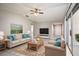 Spacious living room with beige sofa and wooden coffee table at 962 Oropesa Ave, Orlando, FL 32807