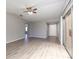 Sun-filled living room with durable wood-look floors leading to the entryway and front door at 962 Oropesa Ave, Orlando, FL 32807