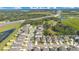 Aerial view of a residential community with houses and a highway nearby at 1162 Alder Tree Dr, Apopka, FL 32703