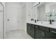 Double vanity bathroom with dark brown cabinets and tile floors at 1162 Alder Tree Dr, Apopka, FL 32703