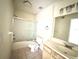 Standard bathroom with shower-tub combination and functional vanity with large mirror at 13803 Fairway Island Dr # 1627, Orlando, FL 32837