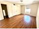 Bedroom featuring laminate floors, neutral walls, and ample natural light from the window at 13803 Fairway Island Dr # 1627, Orlando, FL 32837