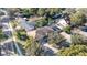 Aerial view of home on tree-lined street with pool and landscaped yard at 290 Thomas Dr, Casselberry, FL 32707