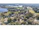 Aerial view of neighborhood near golf course and lake at 290 Thomas Dr, Casselberry, FL 32707