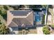 Aerial view showing home with solar panels, pool, and fenced backyard at 290 Thomas Dr, Casselberry, FL 32707