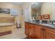 Bathroom features double vanity, granite countertop, and a soaking tub at 290 Thomas Dr, Casselberry, FL 32707