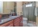 Bathroom with granite countertop and shower/tub combo at 290 Thomas Dr, Casselberry, FL 32707