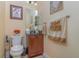 Powder room with dark wood vanity and granite countertop at 290 Thomas Dr, Casselberry, FL 32707