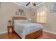 Bedroom with wood floors and light colored bedding at 290 Thomas Dr, Casselberry, FL 32707