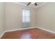 Bright bedroom with hardwood floors and ceiling fan at 290 Thomas Dr, Casselberry, FL 32707