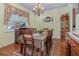 Formal dining room with wood table and chandelier at 290 Thomas Dr, Casselberry, FL 32707