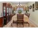 Elegant dining room with hutch and large table setting at 290 Thomas Dr, Casselberry, FL 32707