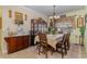 Spacious dining room with wooden hutch and china cabinet at 290 Thomas Dr, Casselberry, FL 32707