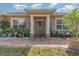 Welcoming front porch with brick pavers and decorative plants at 290 Thomas Dr, Casselberry, FL 32707