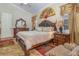 Spacious main bedroom with king-size bed, wood furniture, and ceiling fan at 290 Thomas Dr, Casselberry, FL 32707