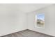 Bedroom with carpeted floor and a window overlooking the front yard at 3427 Narrows Dr, Lakeland, FL 33810