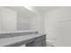 Bathroom features a large vanity, granite countertop, and ample storage space at 5736 Thalia Rd, Lakeland, FL 33810