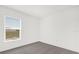 Bedroom featuring neutral carpet and a window with natural light at 5736 Thalia Rd, Lakeland, FL 33810