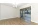 Bright dining room boasts wood-look floors and sliding glass doors to an enclosed porch at 666 Sausalito Blvd, Casselberry, FL 32707