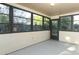 Screened-in Florida Room offering natural light and views of the outdoors at 666 Sausalito Blvd, Casselberry, FL 32707