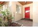 Inviting front entrance featuring a bright red door and tiled entryway at 666 Sausalito Blvd, Casselberry, FL 32707