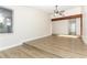 Bright and airy living room with a wooden beam accent and wood-look flooring at 666 Sausalito Blvd, Casselberry, FL 32707