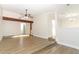 Spacious living room featuring a wooden beam and wood-look floors at 666 Sausalito Blvd, Casselberry, FL 32707