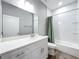 Clean bathroom with white cabinets, a bathtub, and marble-tiled shower at 845 Land Ave, Longwood, FL 32750