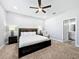 Primary bedroom with a king-size bed and ensuite access at 845 Land Ave, Longwood, FL 32750