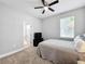 Bright bedroom with double bed, TV, and ensuite bathroom at 845 Land Ave, Longwood, FL 32750