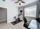 Home office with Peloton bike and desk at 845 Land Ave, Longwood, FL 32750