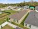 Aerial view showcasing the backyard, patio, and neighborhood homes in a community at 8626 Caribbean Pine Way, Lakeland, FL 33809