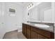 Bathroom features double sinks, granite counters, and tile flooring at 8626 Caribbean Pine Way, Lakeland, FL 33809