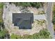 Aerial view of house with dark roof and long driveway at 30 Fisher Trail, Ocklawaha, FL 32179