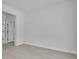 Bright bedroom features light wood-look floors, neutral paint, and trim at 30 Fisher Trail, Ocklawaha, FL 32179