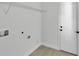 Laundry room with shelving and utility connections at 30 Fisher Trail, Ocklawaha, FL 32179