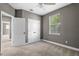 Bright bedroom featuring neutral carpet, ceiling fan, and double door closet at 41 E Spruce St, Orlando, FL 32804