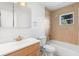 Clean bathroom featuring a shower-tub combination, tiled walls, and a modern sink and vanity at 3703 Pembrook Dr, Orlando, FL 32810