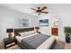 Well-lit bedroom with a ceiling fan, ensuite bathroom, and modern decor for a comfortable and stylish retreat at 3703 Pembrook Dr, Orlando, FL 32810